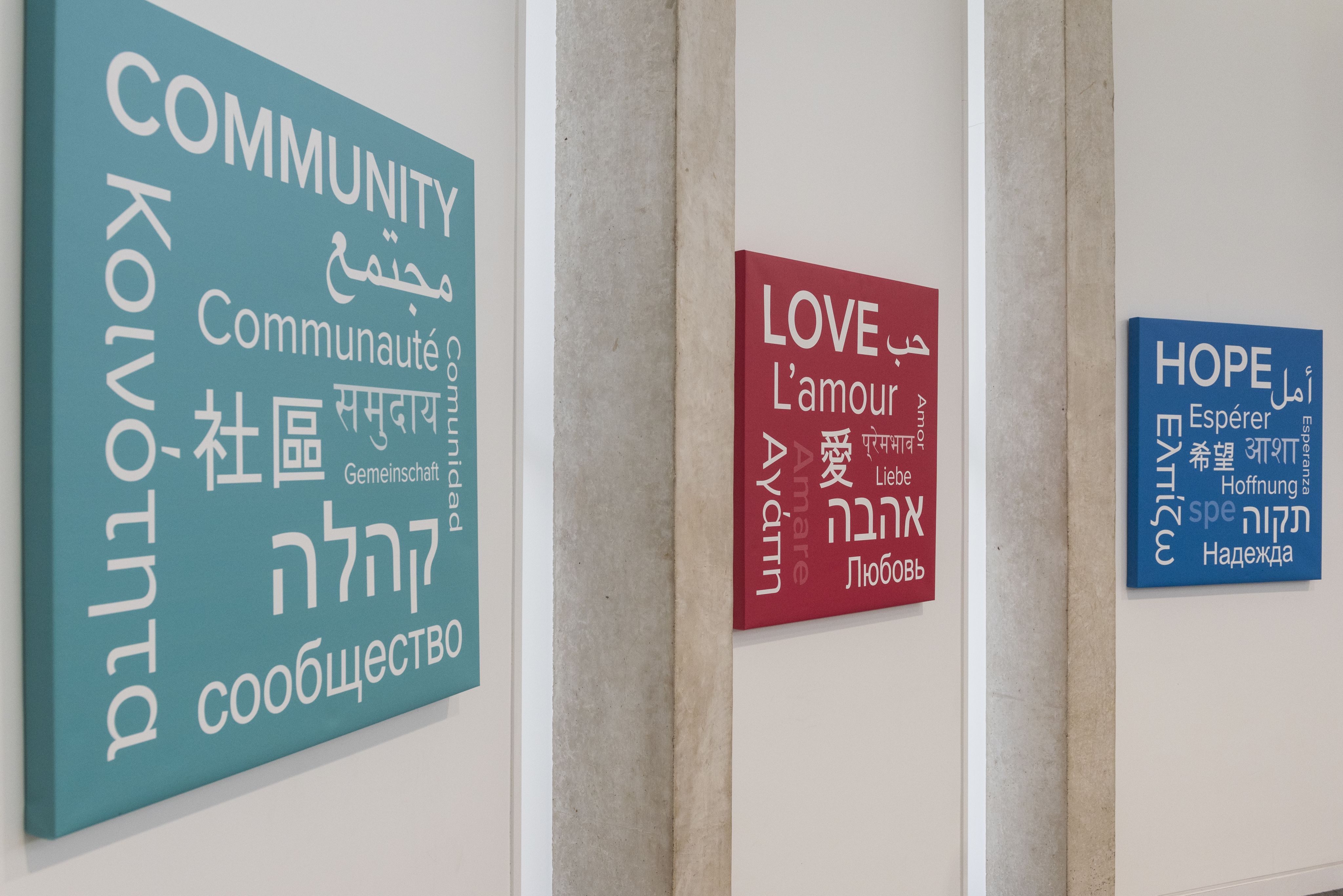 Signs showing love, community and hope in the roundhouse building
