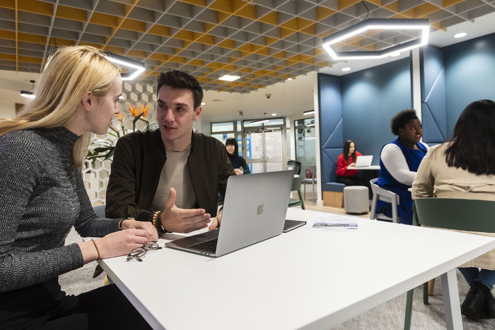 Two students talking in MySurrey Hive