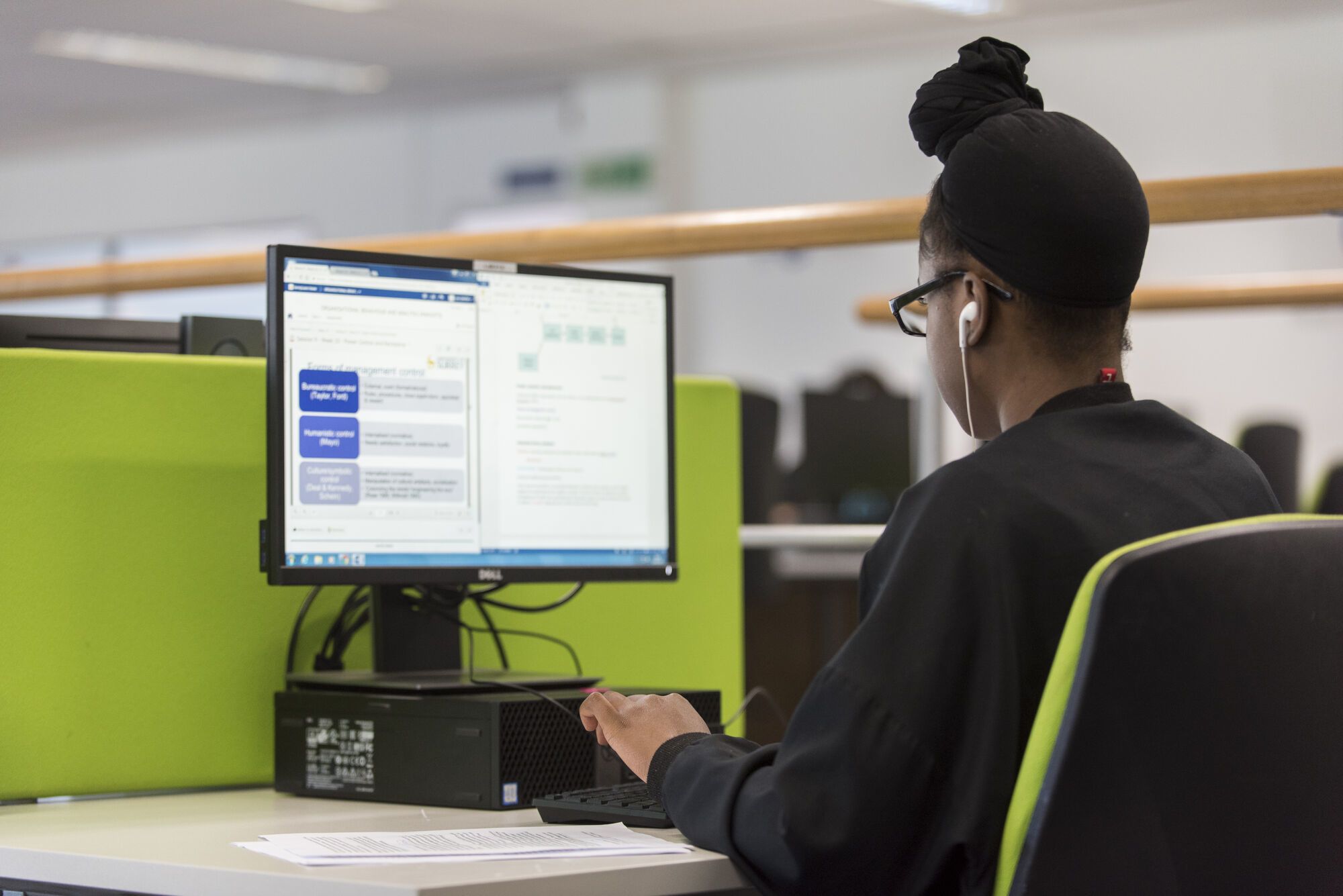 A student studies on a computer in the Library